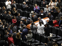 Persons carry a coffin with the body of Ifigenia Martinez during the posthumous funeral tribute in honor of Ifigenia Martinez, 99, in the Ch...