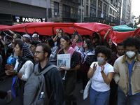 Palestinian supporters march through the streets with flags and signs against the October 2023 Israeli incursion of Gaza, on October 7, 2024...