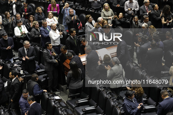 Persons carry a coffin with the body of Ifigenia Martinez during the posthumous funeral tribute in honor of Ifigenia Martinez, 99, in the Ch...