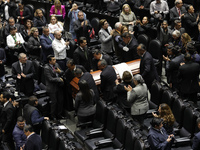 Persons carry a coffin with the body of Ifigenia Martinez during the posthumous funeral tribute in honor of Ifigenia Martinez, 99, in the Ch...