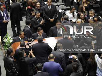 Persons carry a coffin with the body of Ifigenia Martinez during the posthumous funeral tribute in honor of Ifigenia Martinez, 99, in the Ch...