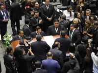 Persons carry a coffin with the body of Ifigenia Martinez during the posthumous funeral tribute in honor of Ifigenia Martinez, 99, in the Ch...