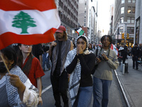 Palestinian supporters march through the streets with flags and signs against the October 2023 Israeli incursion of Gaza, on October 7, 2024...