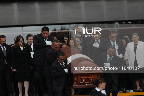 Persons carry a coffin with the body of Ifigenia Martinez during the posthumous funeral tribute in honor of Ifigenia Martinez, 99, in the Ch...