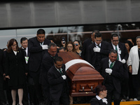 Persons carry a coffin with the body of Ifigenia Martinez during the posthumous funeral tribute in honor of Ifigenia Martinez, 99, in the Ch...