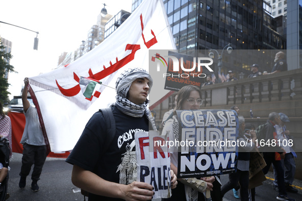 Palestinian supporters march through the streets with flags and signs against the October 2023 Israeli incursion of Gaza, on October 7, 2024...