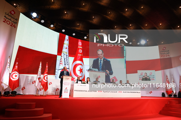 The head of the Tunisian election commission, Farouk Bouasker, along with other members of the Tunisian election commission, gives a press c...