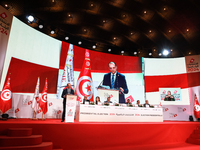 The head of the Tunisian election commission, Farouk Bouasker, along with other members of the Tunisian election commission, gives a press c...