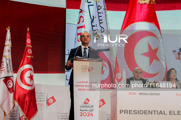 The head of the Tunisian election commission, Farouk Bouasker, along with other members of the Tunisian election commission, gives a press c...