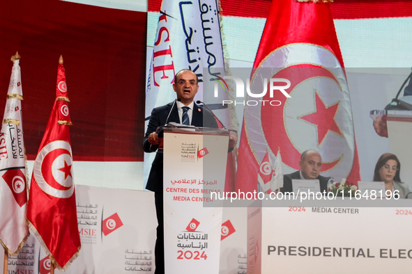 The head of the Tunisian election commission, Farouk Bouasker, along with other members of the Tunisian election commission, gives a press c...