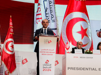 The head of the Tunisian election commission, Farouk Bouasker, along with other members of the Tunisian election commission, gives a press c...