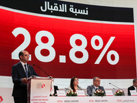 The head of the Tunisian election commission, Farouk Bouasker, along with other members of the Tunisian election commission, gives a press c...