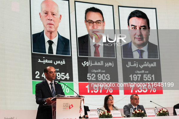 The head of the Tunisian election commission, Farouk Bouasker, along with other members of the Tunisian election commission, gives a press c...