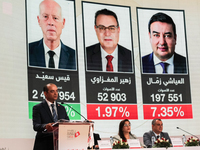 The head of the Tunisian election commission, Farouk Bouasker, along with other members of the Tunisian election commission, gives a press c...