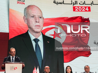 The head of the Tunisian election commission, Farouk Bouasker, along with other members of the Tunisian election commission, gives a press c...