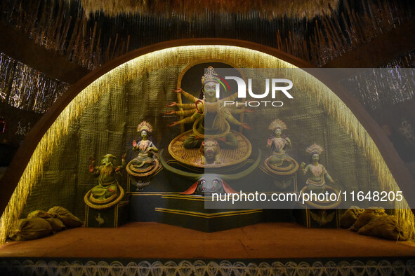 An idol of Goddess Durga is seen at a temporary place of worship called a pandal during the Durga Puja festival celebration in Kolkata, Indi...