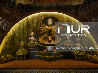 An idol of Goddess Durga is seen at a temporary place of worship called a pandal during the Durga Puja festival celebration in Kolkata, Indi...