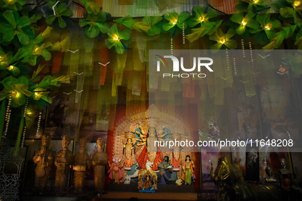 An idol of Goddess Durga is seen at a temporary place of worship called a pandal during the Durga Puja festival celebration in Kolkata, Indi...