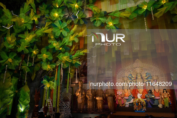 An idol of Goddess Durga is seen at a temporary place of worship called a pandal during the Durga Puja festival celebration in Kolkata, Indi...