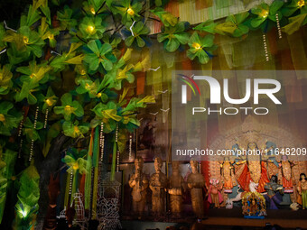 An idol of Goddess Durga is seen at a temporary place of worship called a pandal during the Durga Puja festival celebration in Kolkata, Indi...