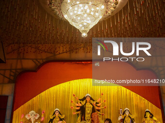 An idol of Goddess Durga is seen at a temporary place of worship called a pandal during the Durga Puja festival celebration in Kolkata, Indi...