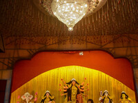 An idol of Goddess Durga is seen at a temporary place of worship called a pandal during the Durga Puja festival celebration in Kolkata, Indi...