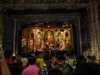 Devotees arrive to see an idol of Goddess Durga at a pandal during the Durga Puja celebration in Kolkata, India, on October 7, 2024. (