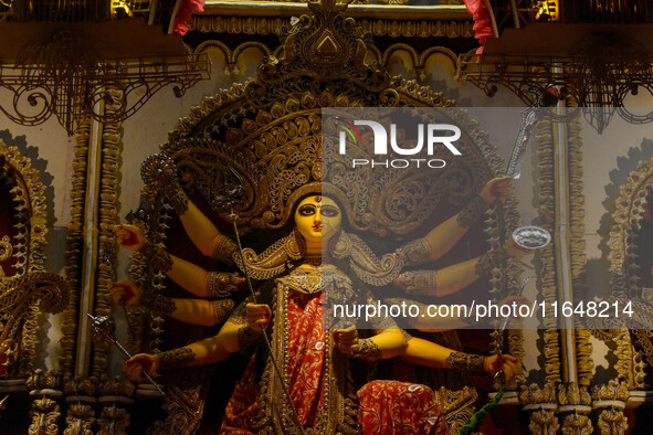 An idol of Goddess Durga is seen at a temporary place of worship called a pandal during the Durga Puja festival celebration in Kolkata, Indi...