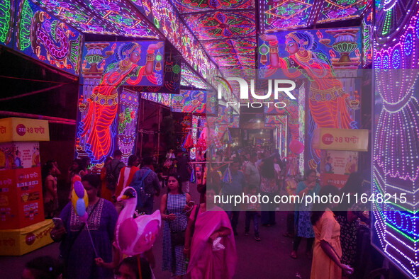 A street is lit with various decorative lights during the Durga Puja festival in Kolkata, India, on October 7, 2024. 