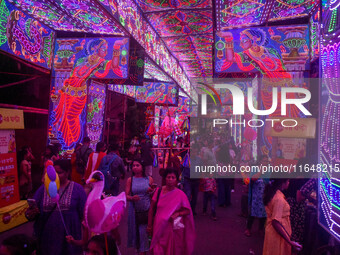 A street is lit with various decorative lights during the Durga Puja festival in Kolkata, India, on October 7, 2024. (