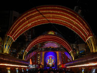 Devotees arrive to see an idol of Goddess Durga at a pandal during the Durga Puja celebration in Kolkata, India, on October 7, 2024. (