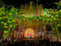 Devotees arrive to see an idol of Goddess Durga at a pandal during the Durga Puja celebration in Kolkata, India, on October 7, 2024. (