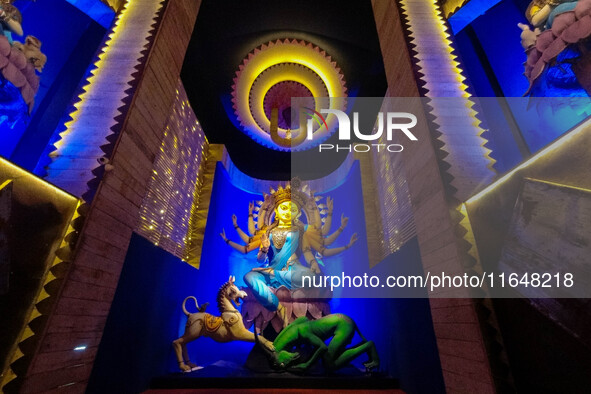 An idol of Goddess Durga is seen at a temporary place of worship called a pandal during the Durga Puja festival celebration in Kolkata, Indi...