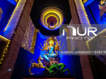 An idol of Goddess Durga is seen at a temporary place of worship called a pandal during the Durga Puja festival celebration in Kolkata, Indi...