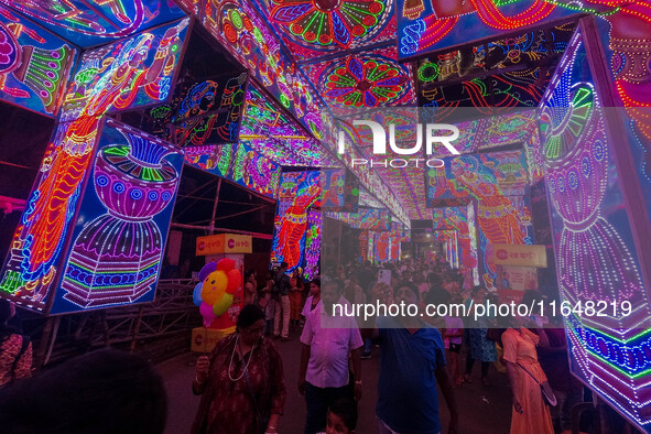 A street is lit with various decorative lights during the Durga Puja festival in Kolkata, India, on October 7, 2024. 