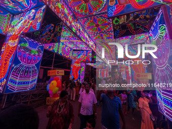 A street is lit with various decorative lights during the Durga Puja festival in Kolkata, India, on October 7, 2024. (