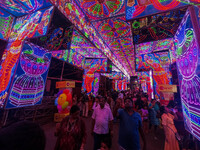 A street is lit with various decorative lights during the Durga Puja festival in Kolkata, India, on October 7, 2024. (