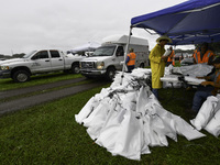 Residents of Orange County, Florida, collect sandbags for free to protect themselves from Hurricane Milton, which is expected this week. The...