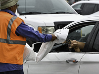 Residents of Orange County, Florida, collect sandbags for free to protect themselves from Hurricane Milton, which is expected this week. The...