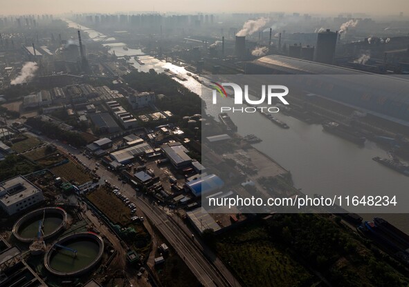 In Huai'an, China, on October 8, 2024, a photo shows transport ships in the port, dock, and river of the Beijing-Hangzhou Grand Canal in Hua...