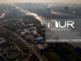 In Huai'an, China, on October 8, 2024, a photo shows transport ships in the port, dock, and river of the Beijing-Hangzhou Grand Canal in Hua...