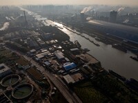 In Huai'an, China, on October 8, 2024, a photo shows transport ships in the port, dock, and river of the Beijing-Hangzhou Grand Canal in Hua...