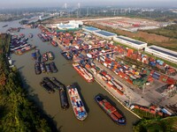 In Huai'an, China, on October 8, 2024, a photo shows transport ships in the port, dock, and river of the Beijing-Hangzhou Grand Canal in Hua...