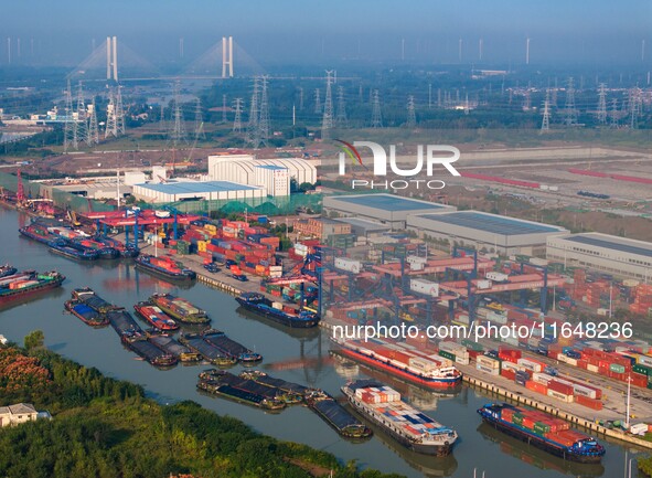 In Huai'an, China, on October 8, 2024, a photo shows transport ships in the port, dock, and river of the Beijing-Hangzhou Grand Canal in Hua...