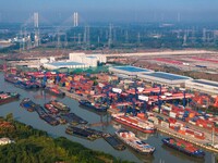 In Huai'an, China, on October 8, 2024, a photo shows transport ships in the port, dock, and river of the Beijing-Hangzhou Grand Canal in Hua...