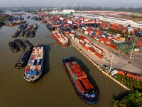 In Huai'an, China, on October 8, 2024, a photo shows transport ships in the port, dock, and river of the Beijing-Hangzhou Grand Canal in Hua...