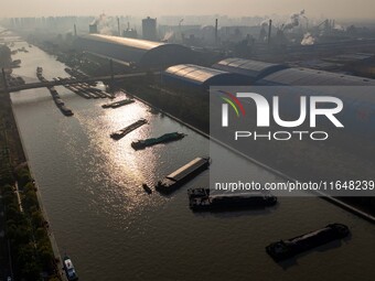 In Huai'an, China, on October 8, 2024, a photo shows transport ships in the port, dock, and river of the Beijing-Hangzhou Grand Canal in Hua...