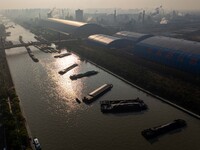 In Huai'an, China, on October 8, 2024, a photo shows transport ships in the port, dock, and river of the Beijing-Hangzhou Grand Canal in Hua...