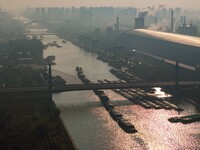 In Huai'an, China, on October 8, 2024, a photo shows transport ships in the port, dock, and river of the Beijing-Hangzhou Grand Canal in Hua...