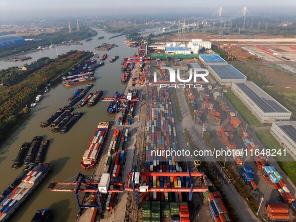 In Huai'an, China, on October 8, 2024, a photo shows transport ships in the port, dock, and river of the Beijing-Hangzhou Grand Canal in Hua...